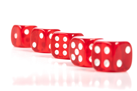 Red Casino Dice Row Isolated On White With Reflectionの写真素材