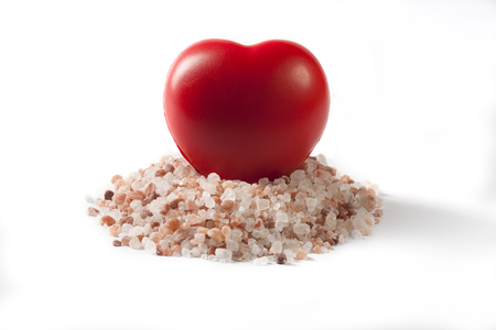 Himalayan Salt Raw Crystals With Red Heart Isolated on White Backgroundの写真素材