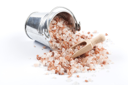 Himalayan Salt Raw Crystals Pile in Silver Metal Bucket Isolated on White Backgroundの写真素材