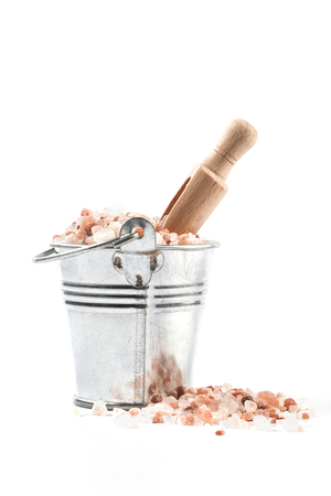 Himalayan Salt Raw Crystals Pile in Silver Metal Bucket Isolated on White Backgroundの写真素材