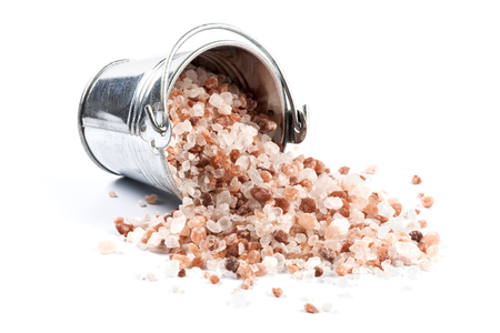 Himalayan Salt Raw Crystals Pile in Silver Metal Bucket Isolated on White Backgroundの写真素材