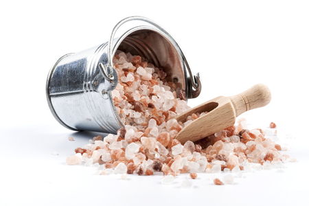 Himalayan Salt Raw Crystals Pile in Silver Metal Bucket Isolated on White Backgroundの写真素材