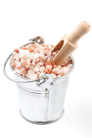 Himalayan Salt Raw Crystals Pile in Silver Metal Bucket Isolated on White Backgroundの写真素材