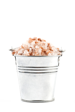 Himalayan Salt Raw Crystals Pile in Silver Metal Bucket Isolated on White Backgroundの写真素材
