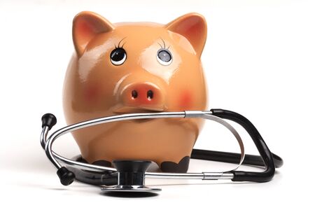 Cute Piggy Bank With Black Stethoscope Isolated on White Backgroundの写真素材