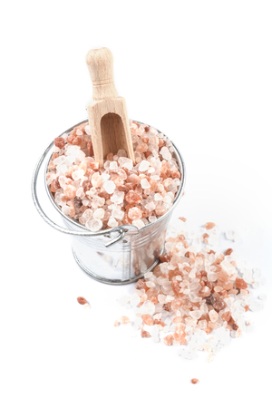 Himalayan Salt Raw Crystals Pile in Silver Metal Bucket Isolated on White Backgroundの写真素材