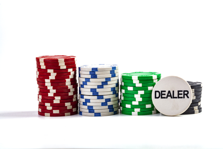 Casino Chips With Dealer Chip Isolated On White Backgroundの写真素材