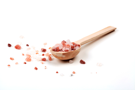 Isolated Himlalayan Salt With Brown Wood Spoonの写真素材
