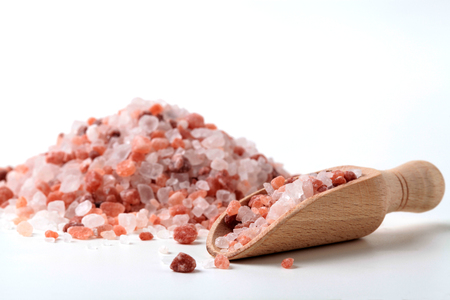 Wodd Spoon with Hymalaya Salt Cristal Pile in The Backgroundの写真素材