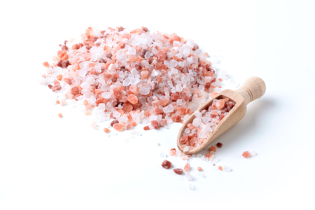 Himalaya Salt Pile With Wood Spice Spoon Isolated On White Backgroundの写真素材