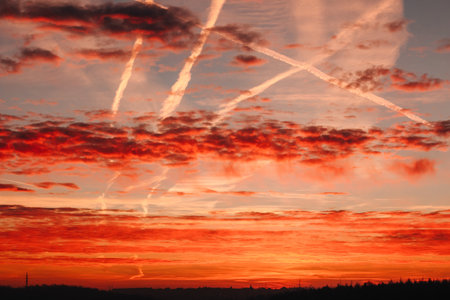 Beautiful sunset sky with clouds and rays of light in the evening