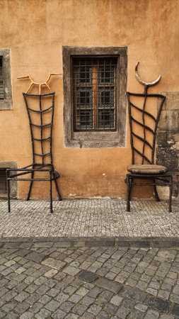 Prague, Czech republic - May 2, 2024: Two chairs district Prague 1, Old Town. Vertical mobile photo. sstkverticalのeditorial素材