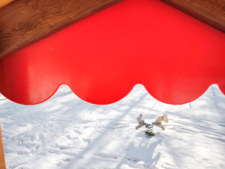 Bright red canopy standing against snow covered landscape, highlighting winter scenery in aosta mountain region, italy Frazionne Lillazの写真素材