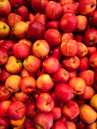 Red apples forming a colorful display at a market