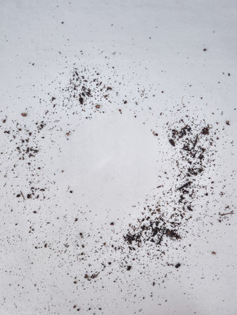 Soil forming a circle on white background, gardening and growth concept copy spaceの写真素材