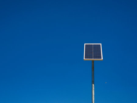Photovoltaic panel converting sunlight into electricity on blue sky copy space