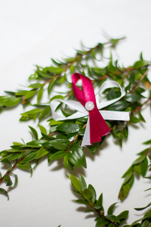 Myrtle sprig with wedding favor ribbon representing unity and celebrationの写真素材