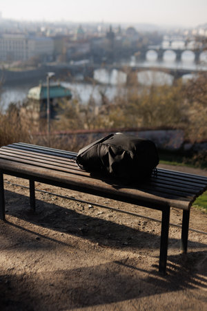 Prague, Czech republic - March 19, 2024: Black peak design everyday backpack on a wooden bench