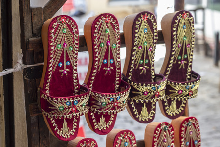 Perspective close-up traditional colorful wooden slippers shot at Izmir in Turkeyの写真素材
