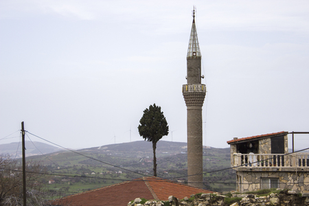 Landscape shot of masonry structed minaret with overcast skyの写真素材