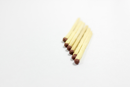 Angled positioned close-up shot of front 6 black match head covered matchesの写真素材