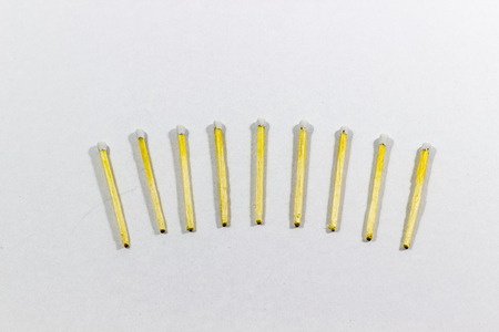 Angled orderly view of front 7 white match head covered matches