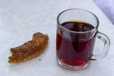 Close-up shoot of Turkish tea in big transparent glass with turkish breakfast food