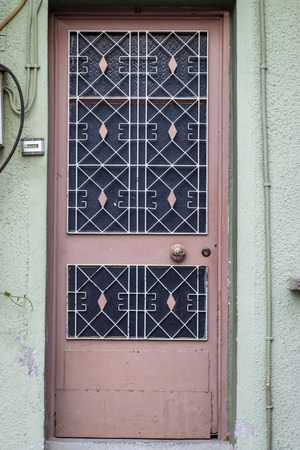 Front shoot of open brown colored metal door with traditional turkish patternの写真素材