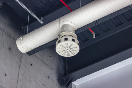 Clean shoot of white colored ventilation pipe inside room