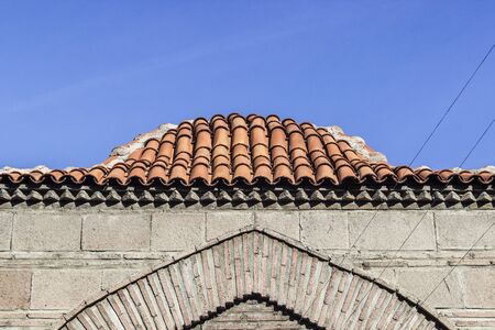 Front shoot of old masonry brick layered covered dome with open background