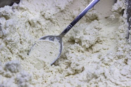 Close-up shoot of traditional tasty turkish mud cheese with metal spoonの写真素材