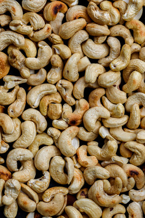 Roasting cashews on an iron plate