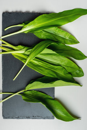 Wild garlic. Wild garlic on a black board on a table