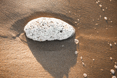 High angle view of stones on beach. sand, sea, stone, summer, sunset.