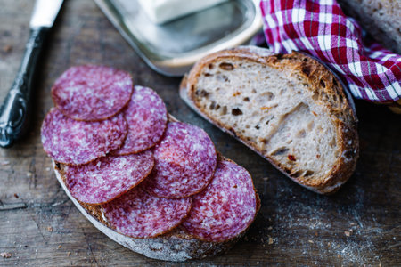 Italian sandwich with salami. Sliced salami with homemade bread.の写真素材
