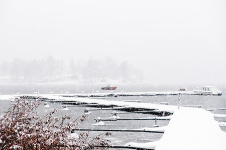 Landscape. . Boat pier in winter. A wonderful winter view of the frozen lake.の写真素材