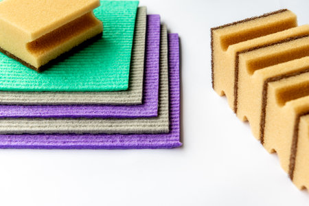 Colorful sponges with visible pores for scrubbing and cleaning. Home maintenance articles, cleaning product ads.の写真素材