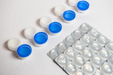 Contact lenses and case on white background, top viewの写真素材