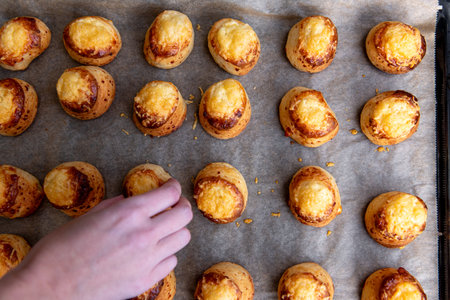 A full tray of fresh salty buns with cheese