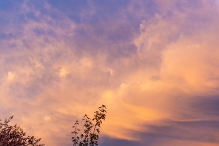 special vivid sunset. blue sky and colorful orange beautiful cloudsの写真素材