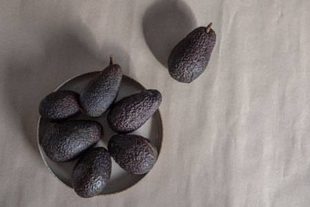 The ripe Hass avocado on craft paper, close-up, top view.の写真素材
