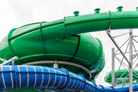 The green blue slide in the water park.の写真素材