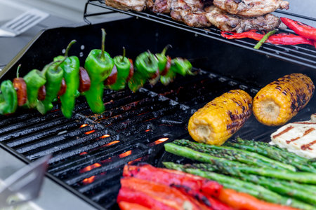 Grilling chicken, corn cobs, paprika, padron, asparagus.の写真素材