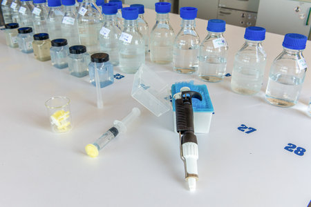 Laboratory equipment. Laboratory storage bottles with blue polypropylene cap, plastic bottles,...