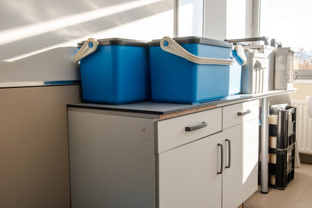Accessories and containers placed on a lab counter, used for collecting and storing water samples...