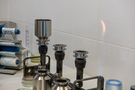 Disinfection and sterilization of stainless steel funnels by flame in a clean, controlled...