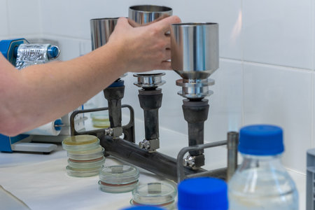 Disinfection and sterilization of stainless steel funnels by flame in a clean, controlled...