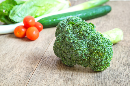 Broccoli,tomatoes,cucumber,beets selective focus at vegetables on background .の写真素材