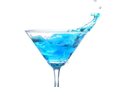 Splash in a martini glass on white backgroundの写真素材