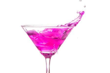 close up martini glass with pink cocktail on white backgroundの写真素材